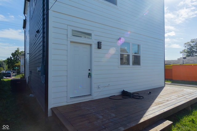 2302 Prospect St, Indianapolis, IN 46203 - back of house with central air condition unit and a deck
