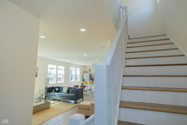 2302 Prospect St, Indianapolis, IN 46203 - staircase with wood finished floors and recessed lighting