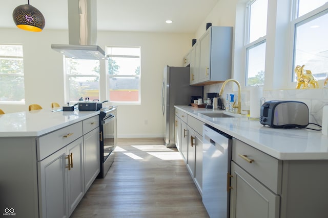 2302 Prospect St, Indianapolis, IN 46203 - kitchen with electric stove, a sink, island exhaust hood, gray cabinets, and dishwashing machine