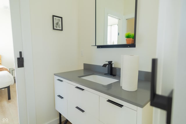 2302 Prospect St, Indianapolis, IN 46203 - bathroom with wood finished floors and vanity