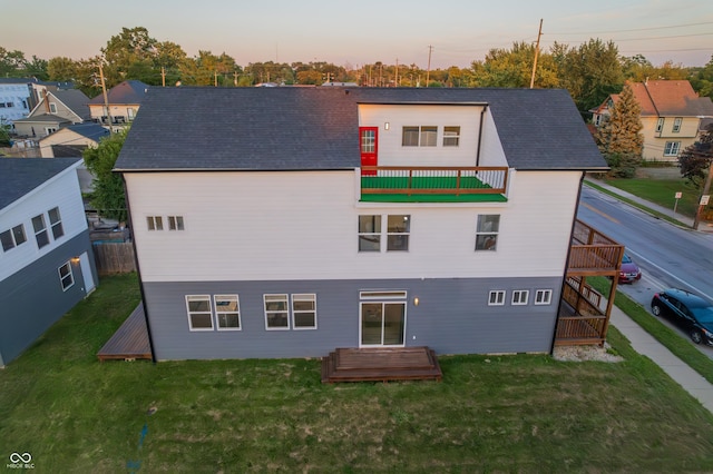 2302 Prospect St, Indianapolis, IN 46203 - back of house with a lawn and a balcony