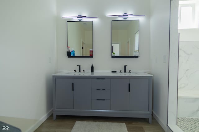 2302 Prospect St, Indianapolis, IN 46203 - bathroom with wood finished floors, a sink, and double vanity