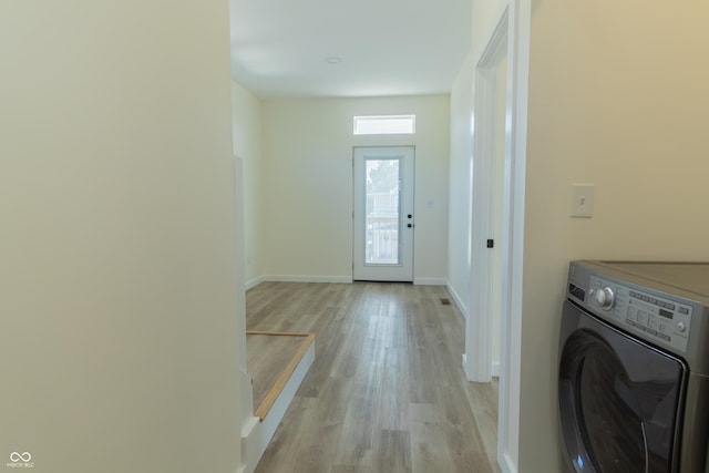 2302 Prospect St, Indianapolis, IN 46203 - washroom featuring washer / dryer, light wood-type flooring, baseboards, and laundry area