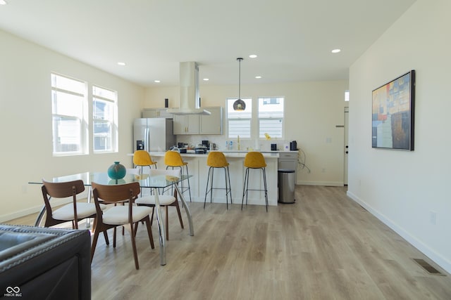 2302 Prospect St, Indianapolis, IN 46203 - dining area featuring recessed lighting, visible vents, light wood finished floors, and plenty of natural light