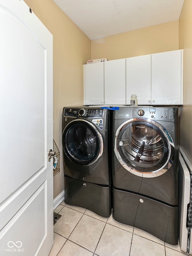 19311 Morrison Way, Noblesville, IN 46060 - washroom with washer and dryer, baseboards, cabinet space, and light tile patterned floors