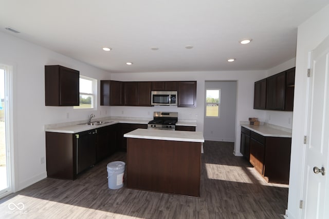 3832 Highcrest Rd, Indianapolis, IN 46239 - kitchen featuring stainless steel appliances, a sink, dark wood-style flooring, light countertops, and baseboards