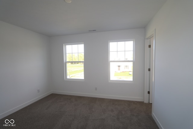 3832 Highcrest Rd, Indianapolis, IN 46239 - unfurnished room with dark carpet and baseboards