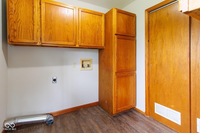 4917 Algonquin Trl, Kokomo, IN 46902 - washroom featuring hookup for a washing machine, dark wood-style flooring, cabinet space, hookup for an electric dryer, and baseboards