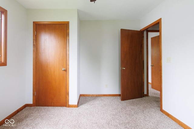 4917 Algonquin Trl, Kokomo, IN 46902 - unfurnished bedroom featuring carpet and baseboards
