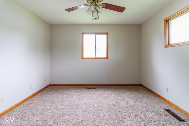 4917 Algonquin Trl, Kokomo, IN 46902 - empty room featuring carpet flooring, a ceiling fan, and baseboards