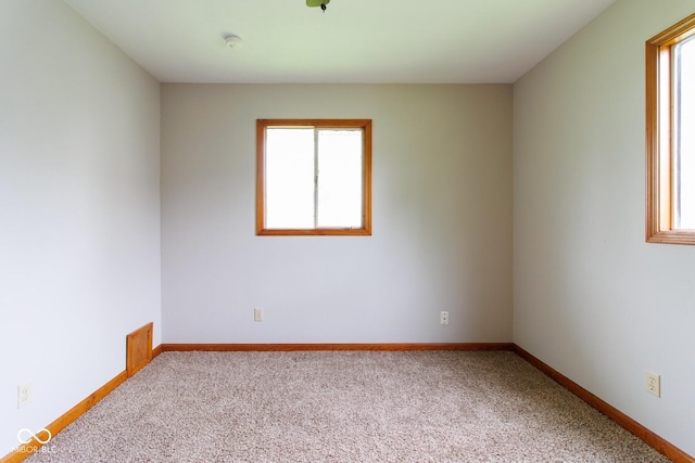 4917 Algonquin Trl, Kokomo, IN 46902 - unfurnished room with healthy amount of natural light, light colored carpet, and baseboards