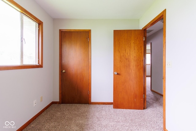 4917 Algonquin Trl, Kokomo, IN 46902 - unfurnished bedroom with carpet, baseboards, and a closet