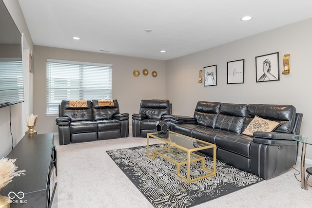 carpeted living area featuring recessed lighting