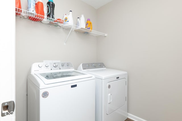 washroom with laundry area and washing machine and dryer