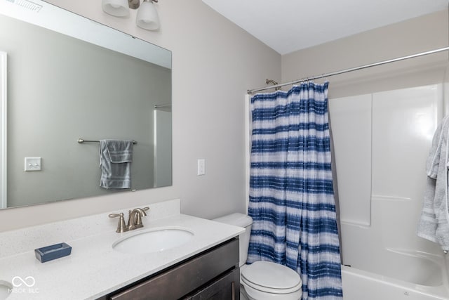 bathroom featuring toilet, shower / bath combination with curtain, visible vents, and vanity