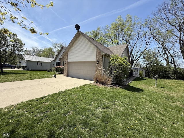 view of property exterior featuring an attached garage, brick siding, a yard, and concrete driveway