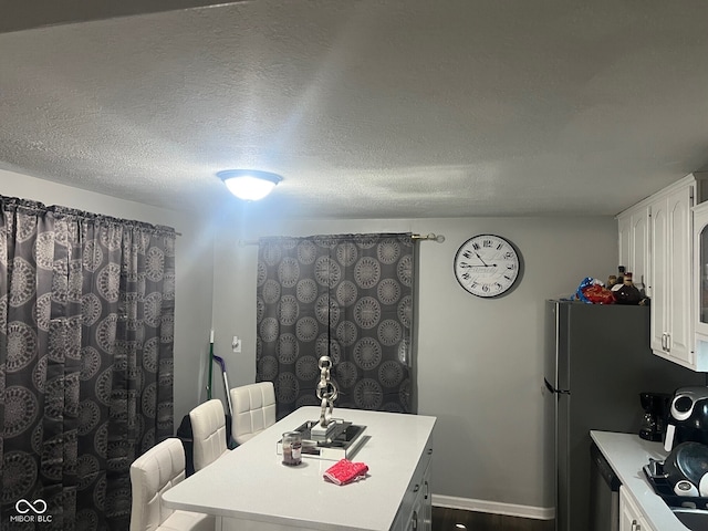 7206 Halden Pl, Indianapolis, IN 46214 - dining room with a textured ceiling and baseboards