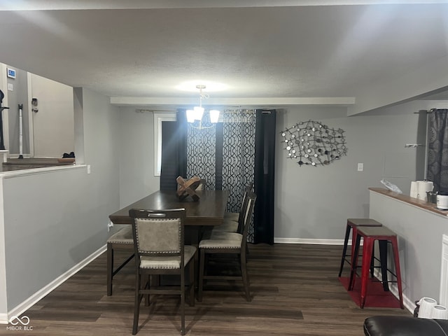 7206 Halden Pl, Indianapolis, IN 46214 - dining area featuring dark wood finished floors, baseboards, and a chandelier