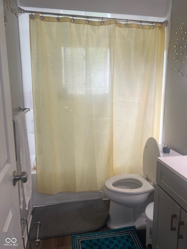 7206 Halden Pl, Indianapolis, IN 46214 - bathroom featuring toilet, vanity, and shower / tub combo with curtain