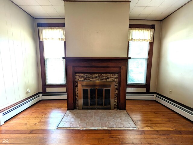 4335 River Rd, Columbus, IN 47203 - unfurnished living room featuring crown molding, wood-type flooring, and a fireplace with flush hearth