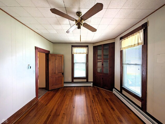 4335 River Rd, Columbus, IN 47203 - foyer entrance with baseboard heating, dark wood-style floors, and a ceiling fan