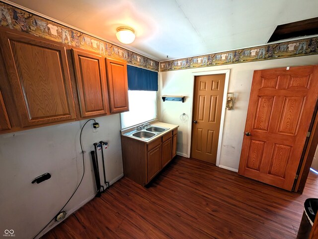 4335 River Rd, Columbus, IN 47203 - laundry room with cabinet space, dark wood-style floors, hookup for a washing machine, and baseboards