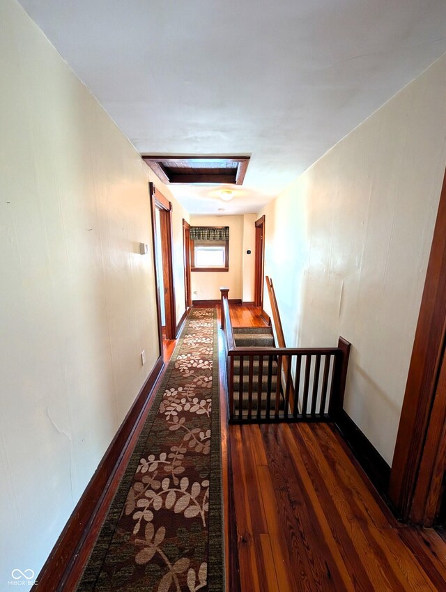 4335 River Rd, Columbus, IN 47203 - hall with dark wood finished floors, an upstairs landing, and baseboards