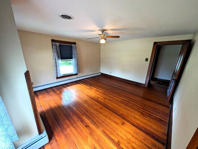 4335 River Rd, Columbus, IN 47203 - unfurnished room with baseboard heating, ceiling fan, wood-type flooring, and baseboards