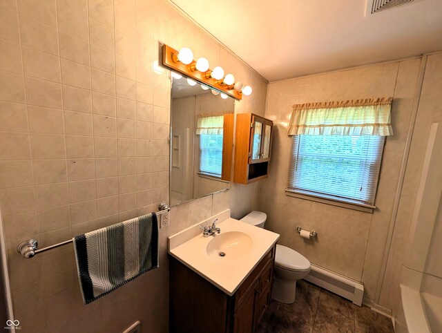 4335 River Rd, Columbus, IN 47203 - full bath with baseboard heating, vanity, and toilet