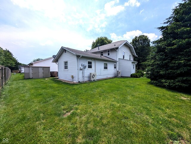 4335 River Rd, Columbus, IN 47203 - rear view of house featuring ac unit and roof with shingles
