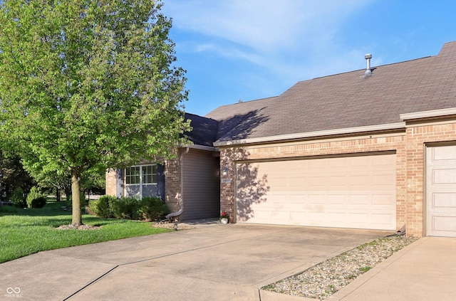 view of front of house featuring concrete driveway, brick siding, a shingled roof, and a garage