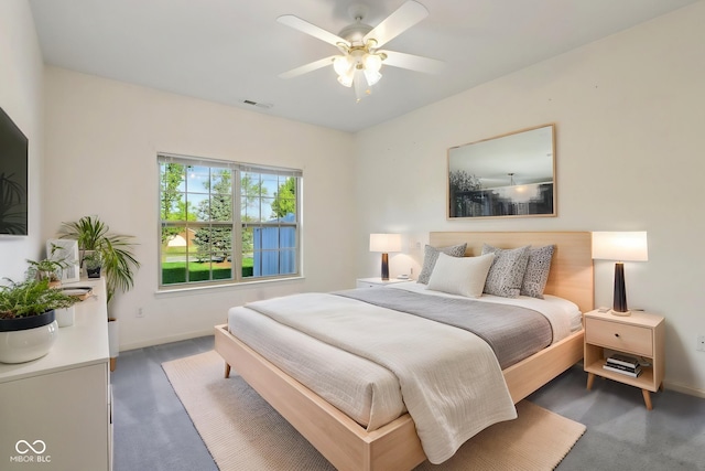 bedroom with carpet floors, a ceiling fan, baseboards, and visible vents