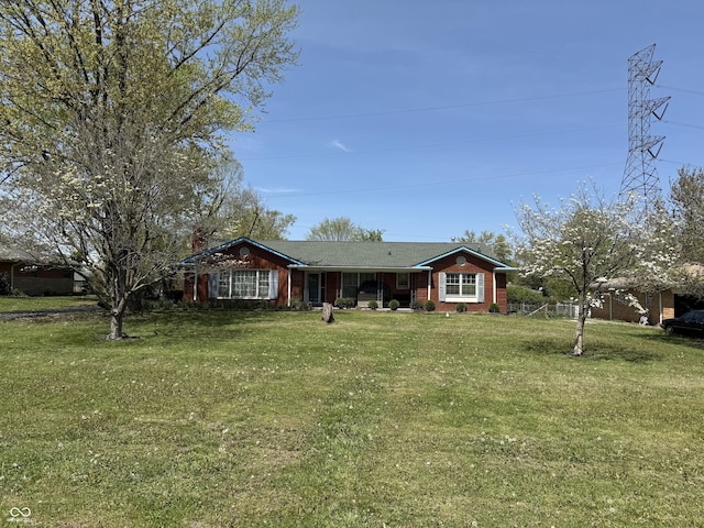 ranch-style house featuring a front lawn