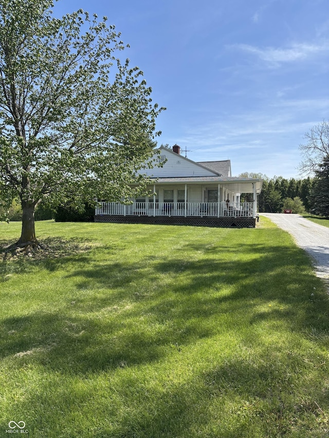 3333 S Sr 9, Greenfield, IN 46140 - view of front of home with a front lawn, covered porch, and a chimney