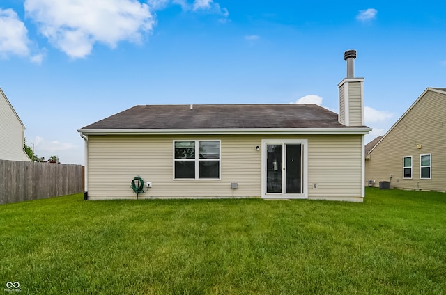 2138 Rossington Ln, Indianapolis, IN 46229 - rear view of property featuring central AC and a chimney