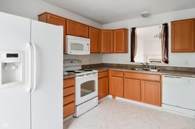 2138 Rossington Ln, Indianapolis, IN 46229 - kitchen featuring white appliances, a sink, light marble finish floors, and brown cabinetry