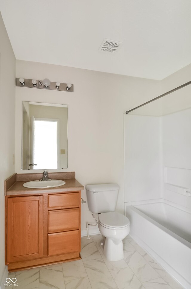 2138 Rossington Ln, Indianapolis, IN 46229 - full bathroom with marble look tiles, vanity, toilet, and tub / shower combination