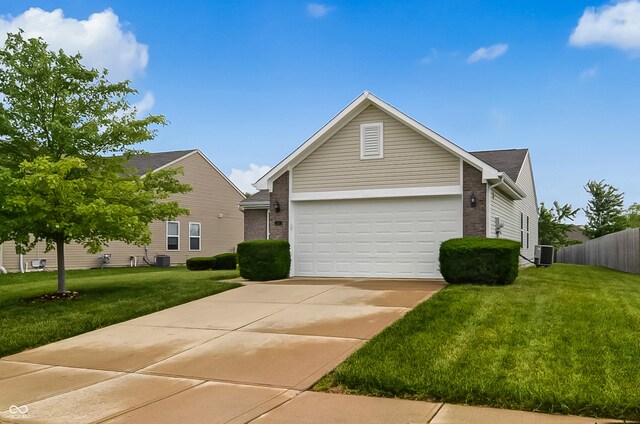2138 Rossington Ln, Indianapolis, IN 46229 - view of front of home with cooling unit, driveway, and a garage