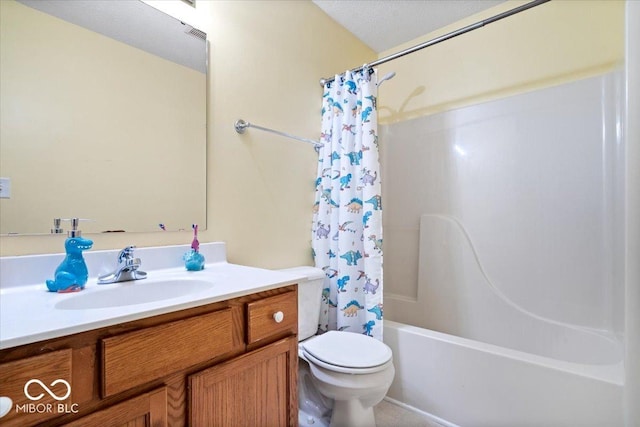 bathroom with vanity, shower / tub combo with curtain, and toilet