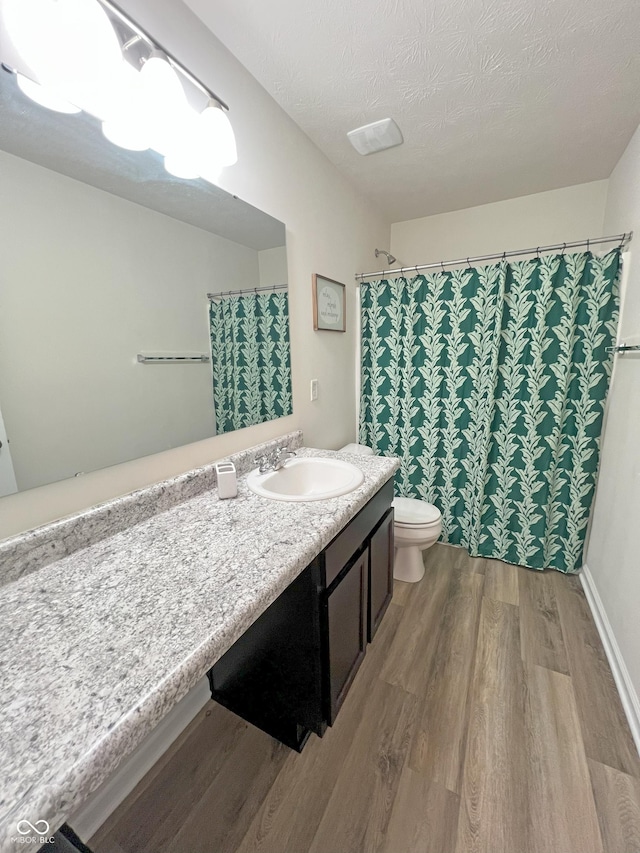 4245 W Fork Dr, Westfield, IN 46062 - full bathroom featuring wood finished floors, toilet, vanity, and a shower with curtain