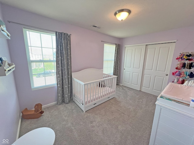 4245 W Fork Dr, Westfield, IN 46062 - carpeted bedroom with multiple windows, a closet, baseboards, and a crib