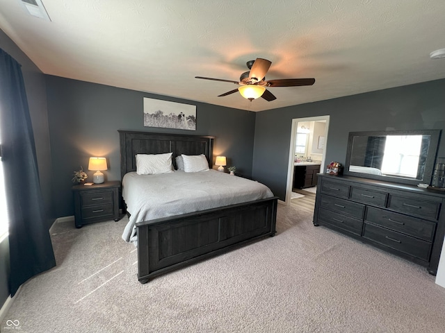 4245 W Fork Dr, Westfield, IN 46062 - bedroom with light colored carpet, baseboards, a ceiling fan, and connected bathroom