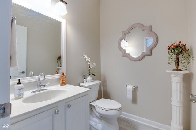 6054 Easy Ln, Indianapolis, IN 46259 - half bathroom with toilet, vanity, and wood finished floors