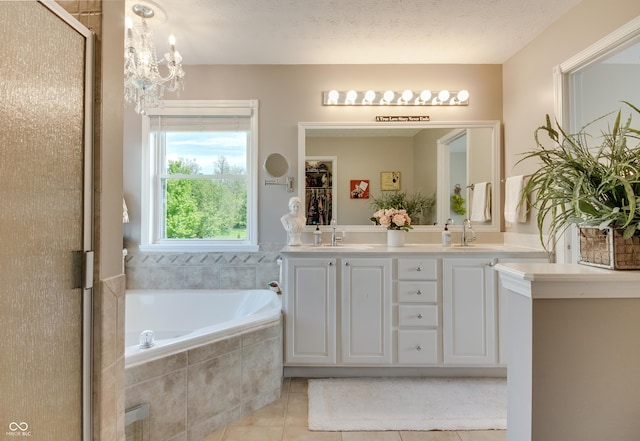 6054 Easy Ln, Indianapolis, IN 46259 - bathroom featuring tile patterned flooring, a garden tub, double vanity, and an enclosed shower