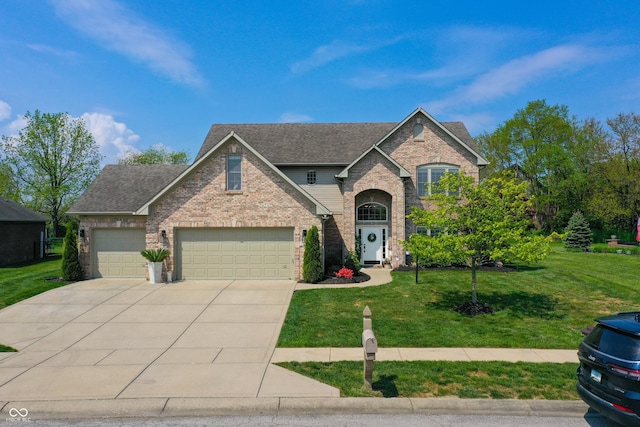6054 Easy Ln, Indianapolis, IN 46259 - traditional home featuring brick siding, concrete driveway, and a front yard
