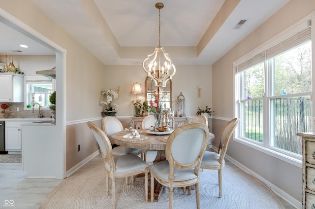 6054 Easy Ln, Indianapolis, IN 46259 - dining room with baseboards, a chandelier, and a tray ceiling