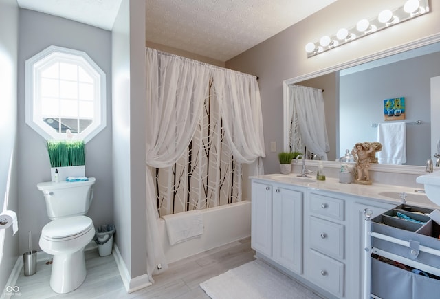 6054 Easy Ln, Indianapolis, IN 46259 - bathroom featuring double vanity, toilet, wood finished floors, shower / bath combo with shower curtain, and a textured ceiling