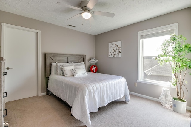 6054 Easy Ln, Indianapolis, IN 46259 - bedroom with light carpet, a ceiling fan, a textured ceiling, and baseboards