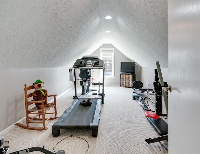 6054 Easy Ln, Indianapolis, IN 46259 - workout area with a textured ceiling, baseboards, vaulted ceiling, and carpet