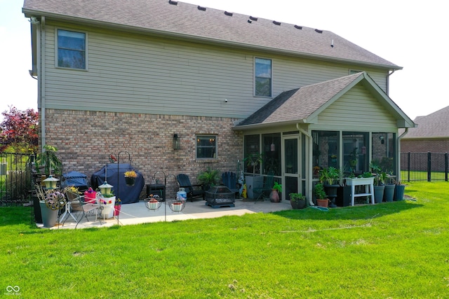 6054 Easy Ln, Indianapolis, IN 46259 - back of property featuring a sunroom, a patio, brick siding, and roof with shingles